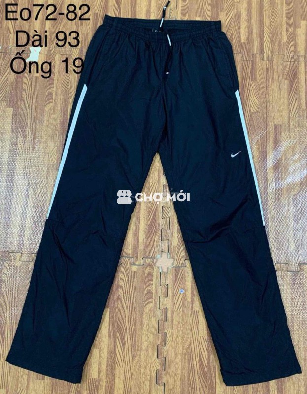 Quần gió Nike running