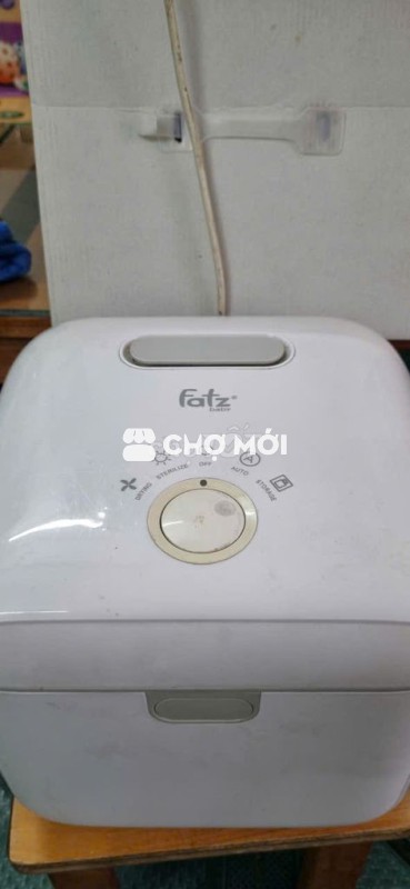 Máy tiệt trùng bình sữa cho bé còn mới