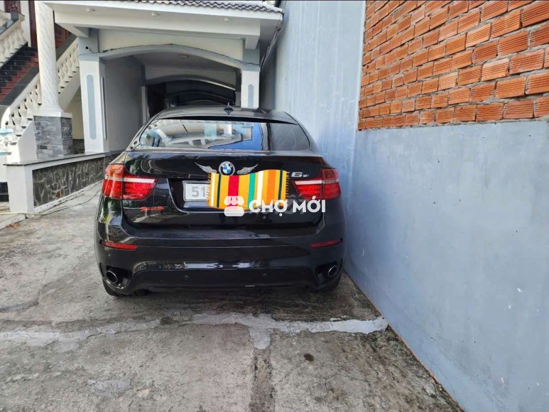 Bán 1 xe 2012 đen tặng 1 xe X6 màu trắng sx 2008