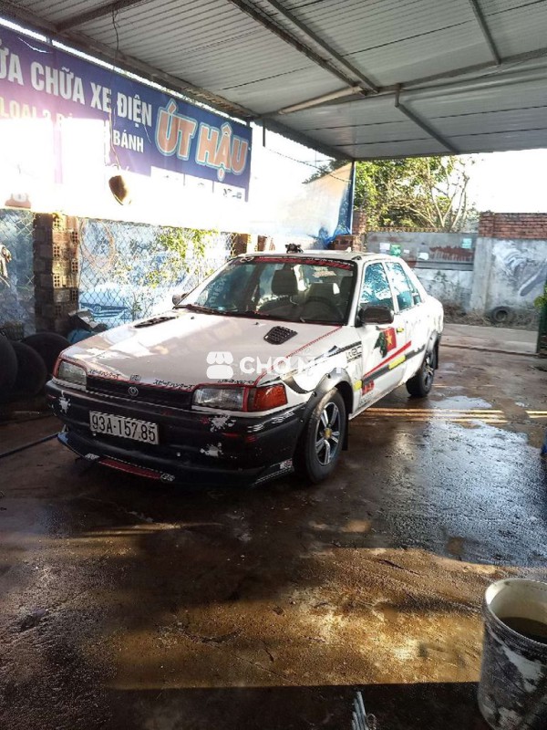 Mazda 323 Trắng 2000km